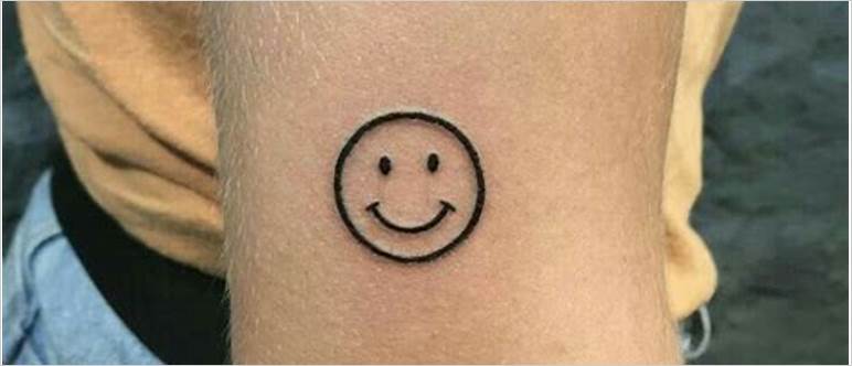 Smiley face tattoo meaning